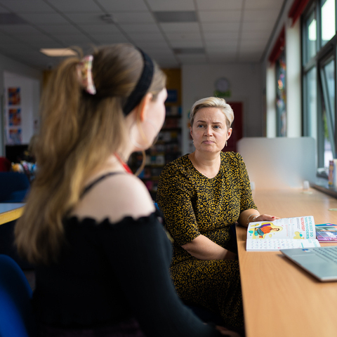 Adviser and student chatting