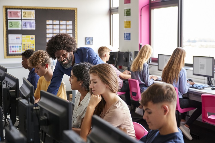 Adviser with students in class