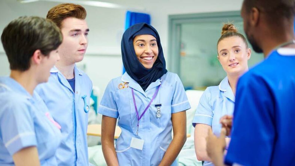 A group of student nurses in a hospital