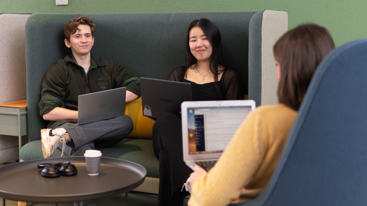 Industry_Marketing_Student_Living_Image_Box_1 A group of students sat in a communal working space