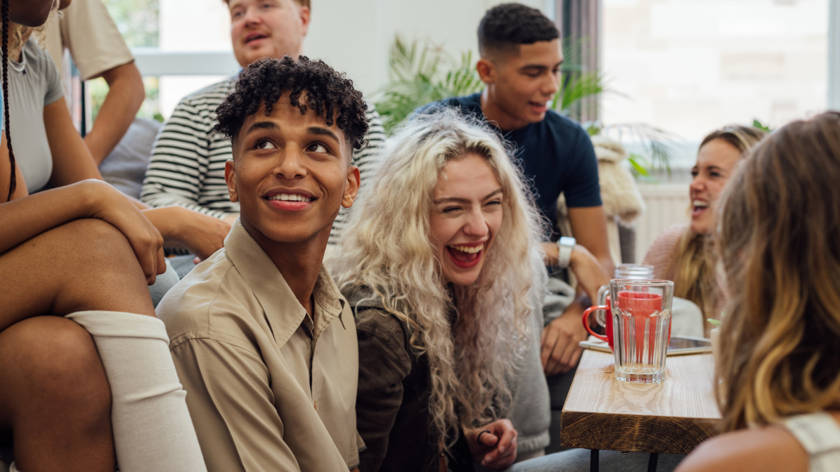 web-ucas-marketing-services-homepage-image-box-1.png A diverse group of young people sat talking and laughing