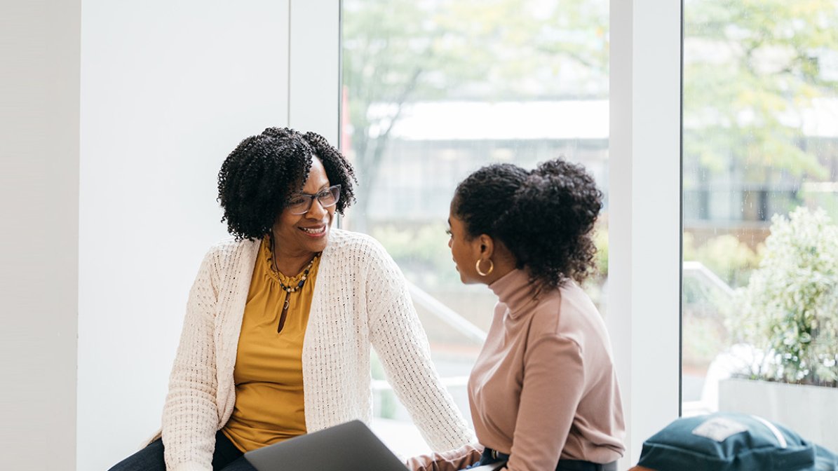 Adviser speaking to student