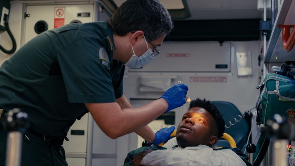 paramedic Paramedic treating patient in an ambulance