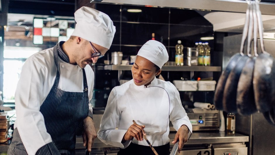 Chefs cooking in a professional kitchen