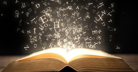 English letters falling into a book