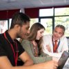 Adviser with two students sitting at a desk