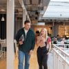 Two employees in the workplace communal area